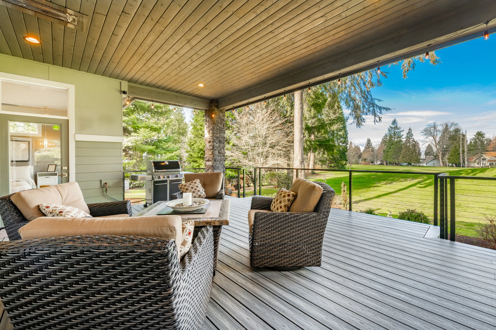 Covered composite deck with lounge furniture by DMV Home Improvement in Washington, D.C.