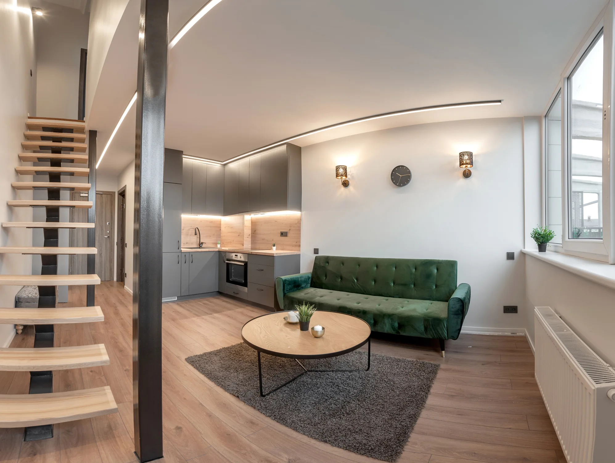 Modern basement loft with open staircase and living area