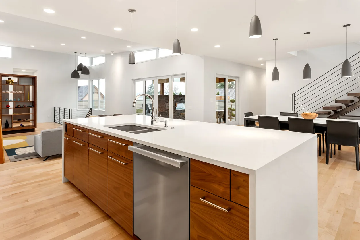 Modern kitchen renovation with walnut island