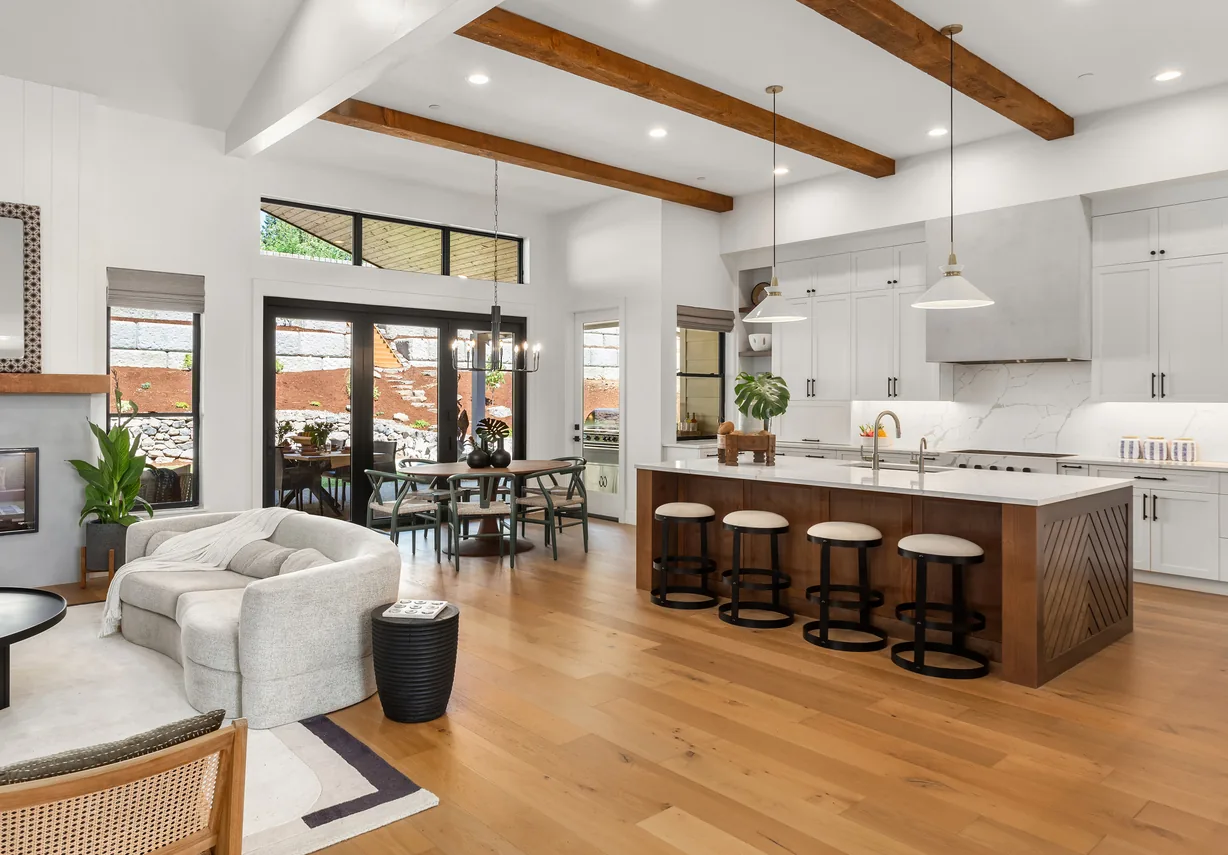 Open plan kitchen with beamed ceiling and island