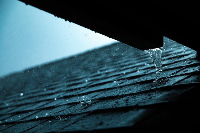 Water dripping off a renovated roof